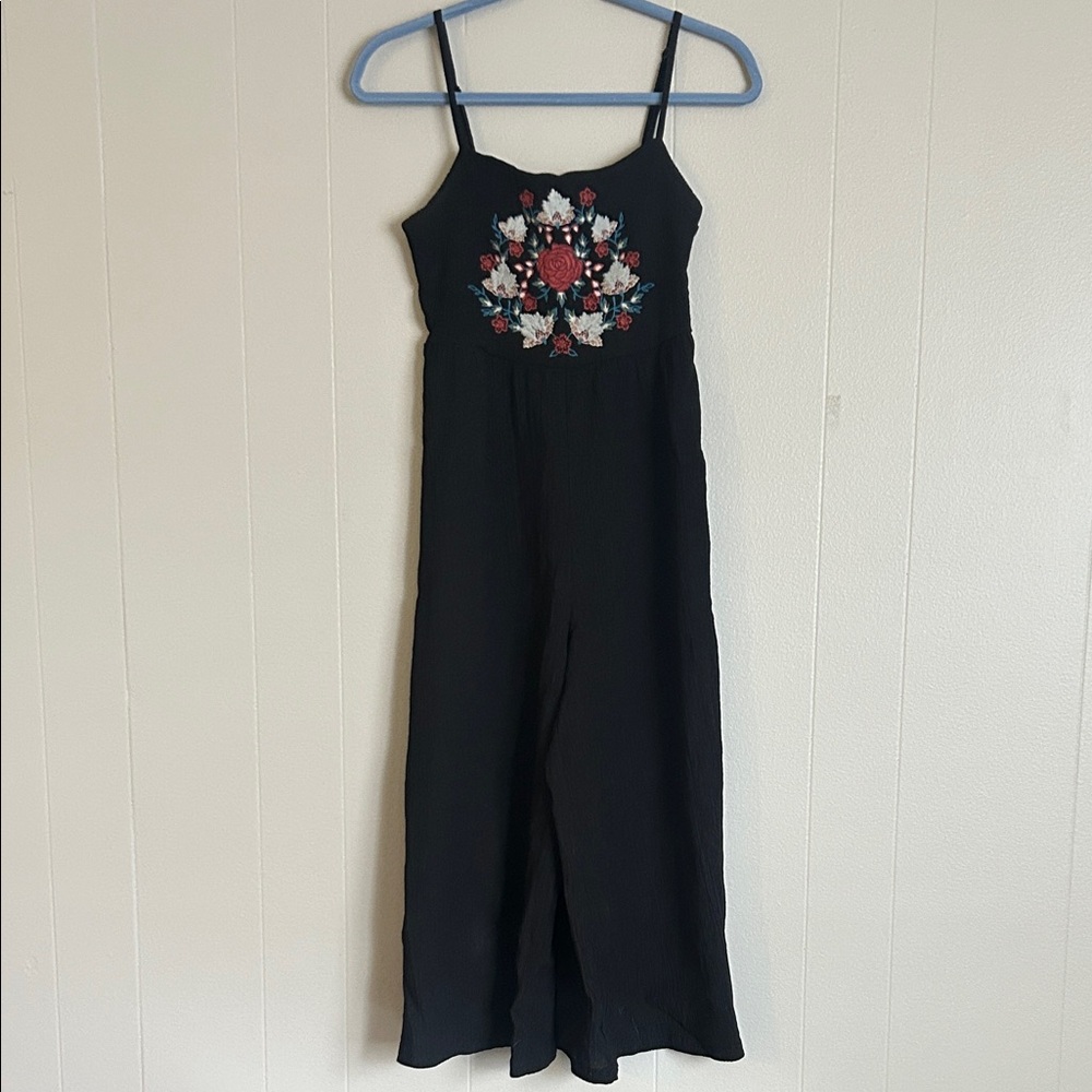 Black wide leg jumpsuit with embroidered flowers on chest